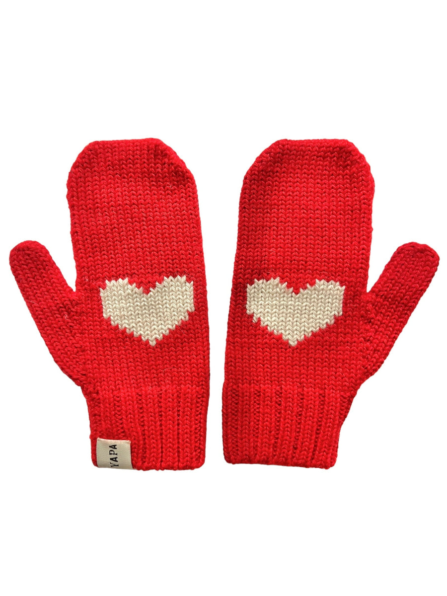 A pair of red knitted mittens with a heart design on the front, displayed against a white background.