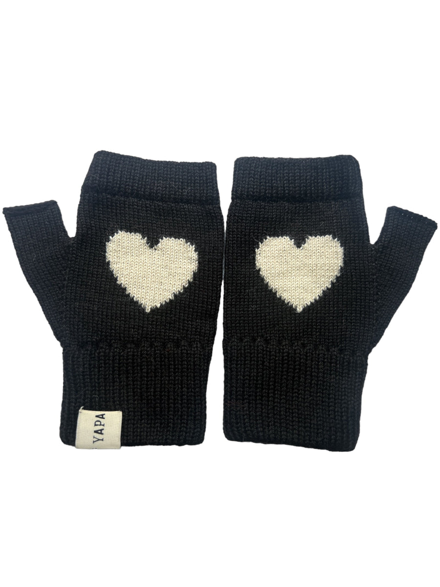 A pair of black baby alpaca wool mittens with a white heart design on the back, displayed against a white background.