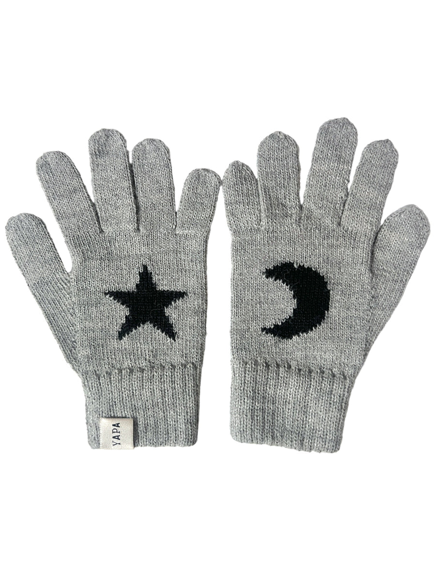 black alpaca knitted gloves with a white star and moon design in each hand