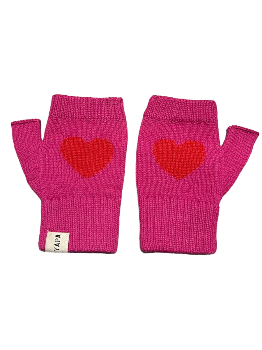 A pair of hot pink alpaca wool mittens with a heart design on the back of the hands, displayed against a white background.