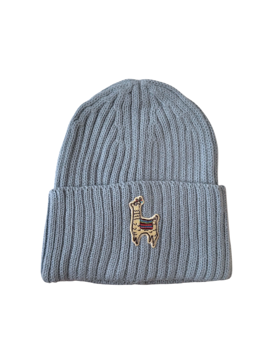 Blue beanie with a small embroidered llama design on a white background
