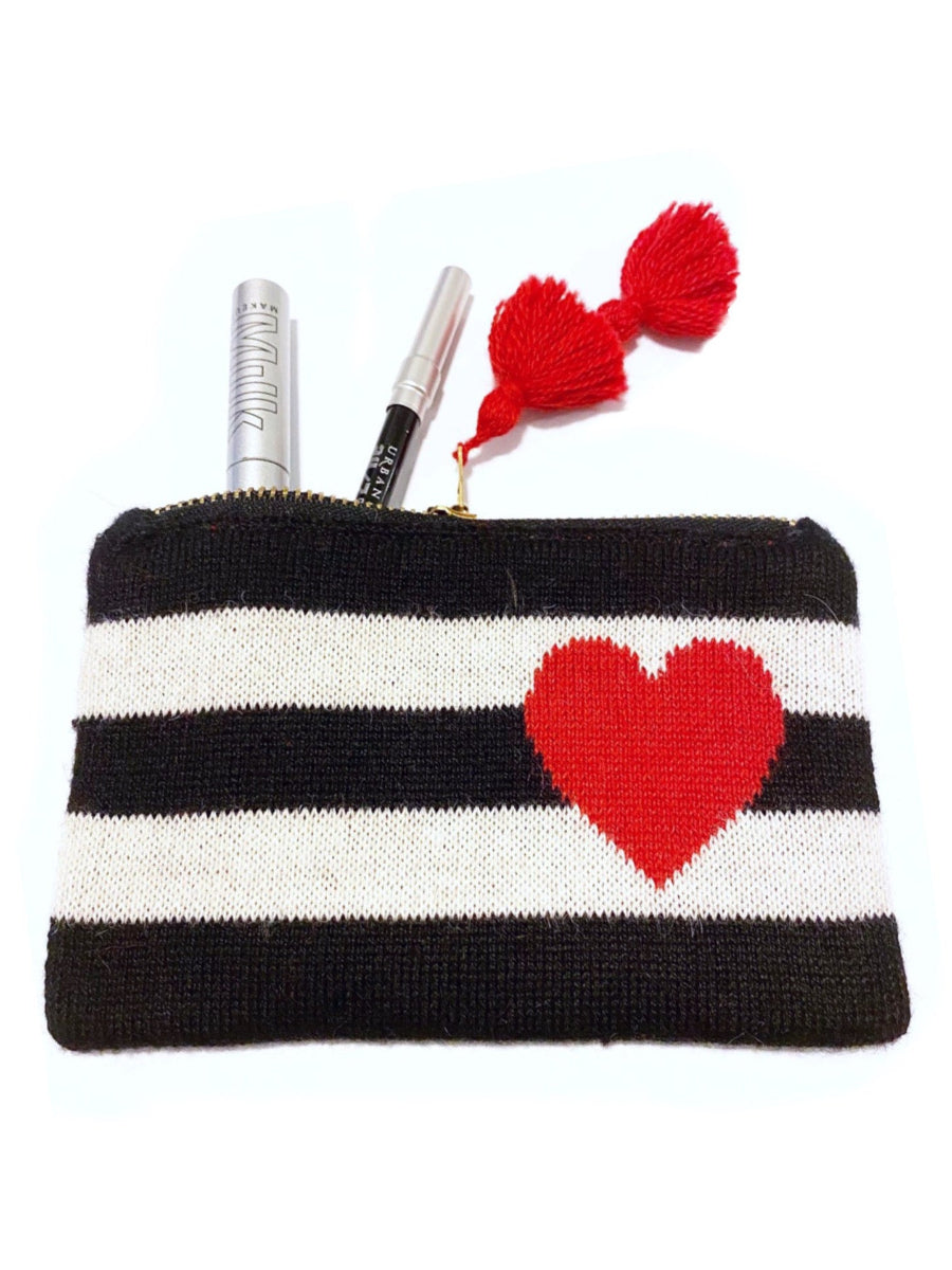 Black-and-white striped alpaca makeup bag featuring a red heart motif on the front, finished with a zipper closure and red tassel detail, shown against a plain background.