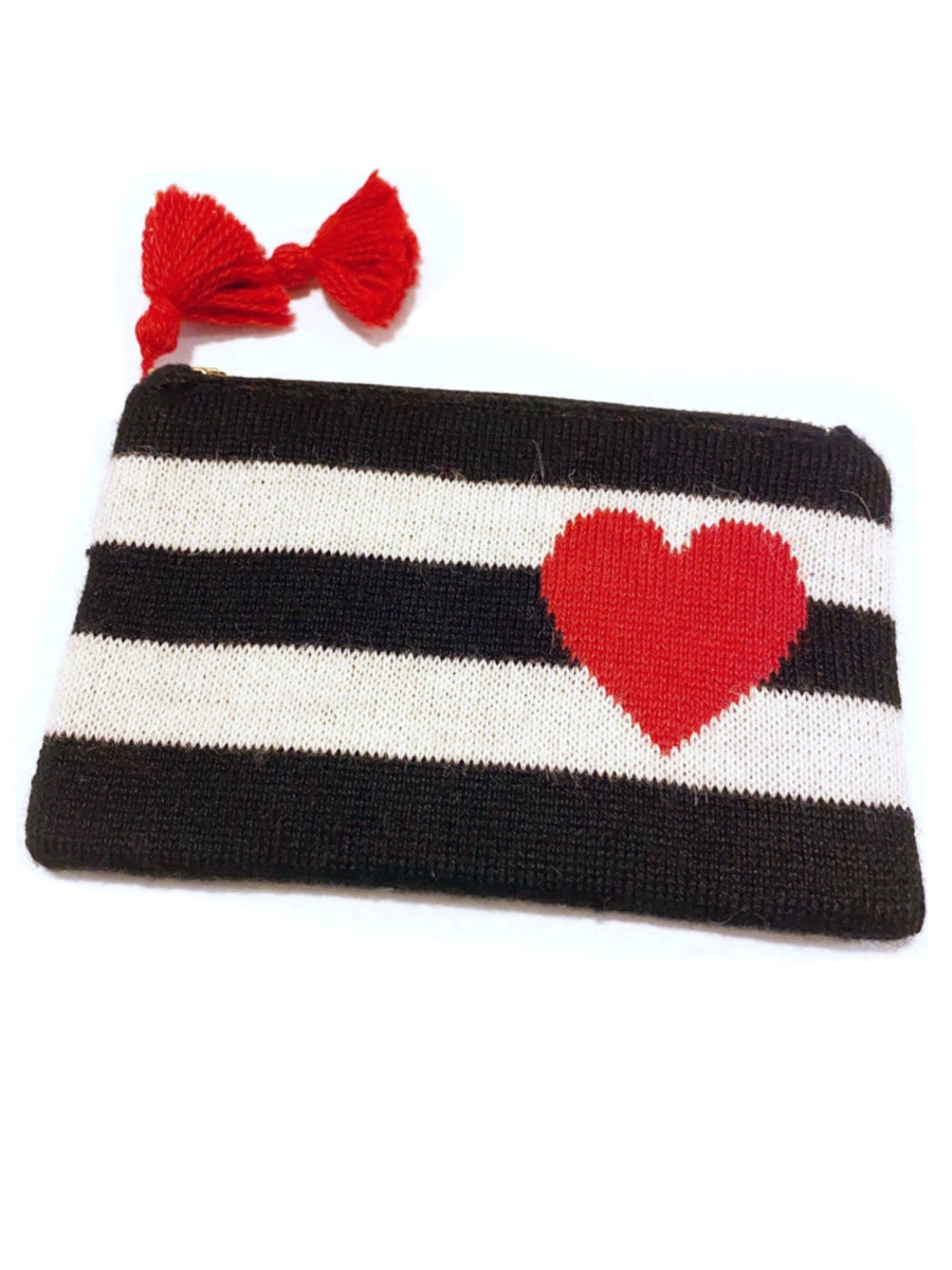 Black-and-white striped alpaca makeup bag featuring a red heart motif on the front, finished with a zipper closure and red tassel detail, shown against a plain background.