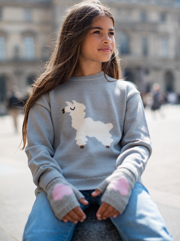 girl wearing alpaca design girls sweater and heart mittens yapa