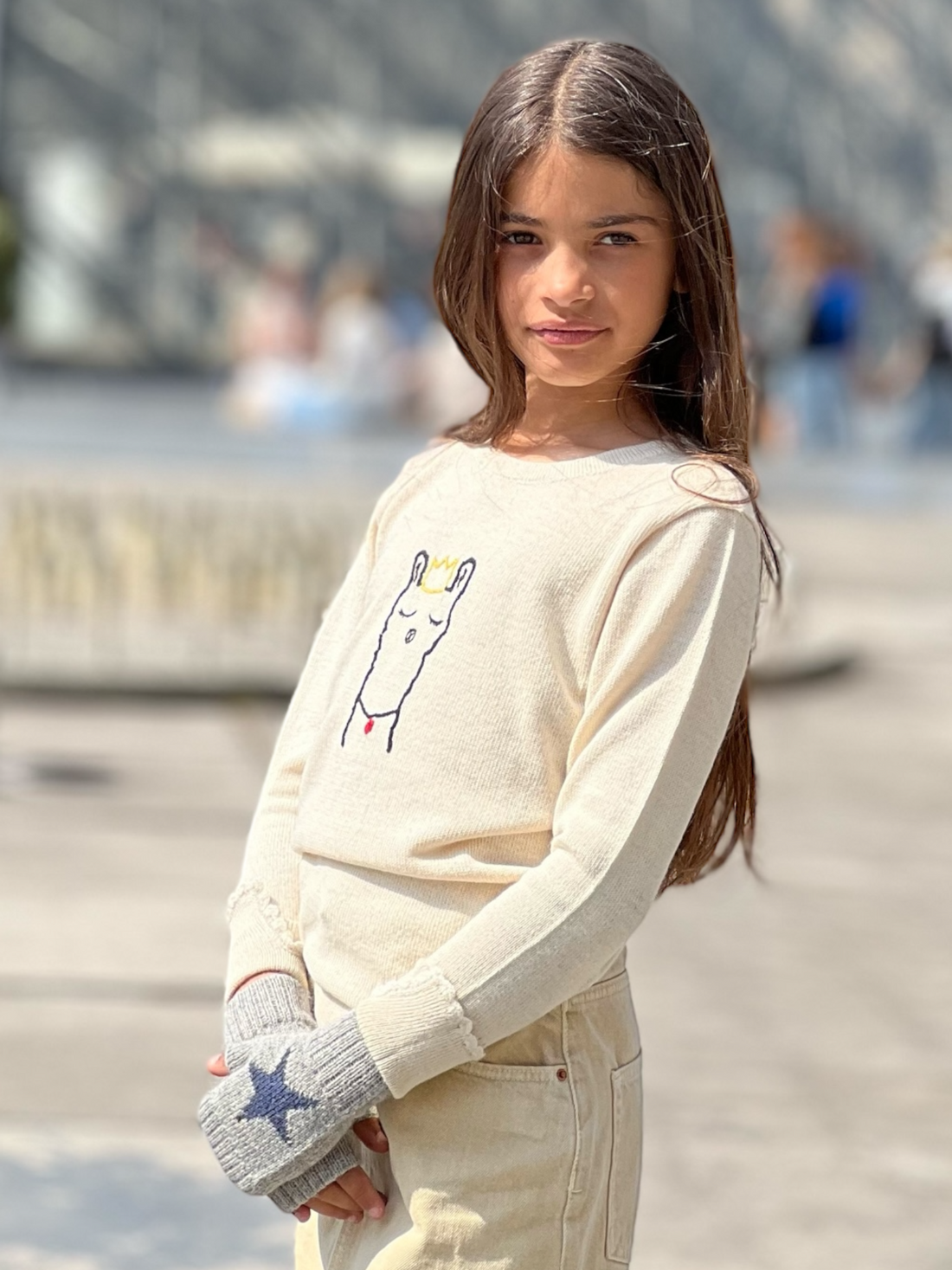 girl wearing an alpaca sweater outdoors