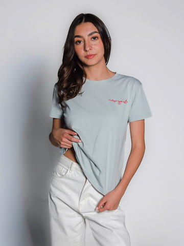 aqua cotton t-shirt featuring a small red “new york” embroidery on the chest, shown here on a model iwith a plain background