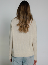 Load image into Gallery viewer, Person wearing a beige sweater with a plain background
