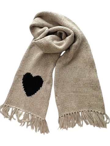 Beige llama scarf featuring a black heart motif on one end with fringed edges, shown against a plain background.