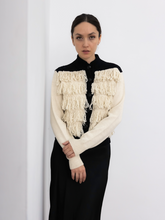 Load image into Gallery viewer, button up alpaca fringed cardigan white with black rib on a model with a white background

