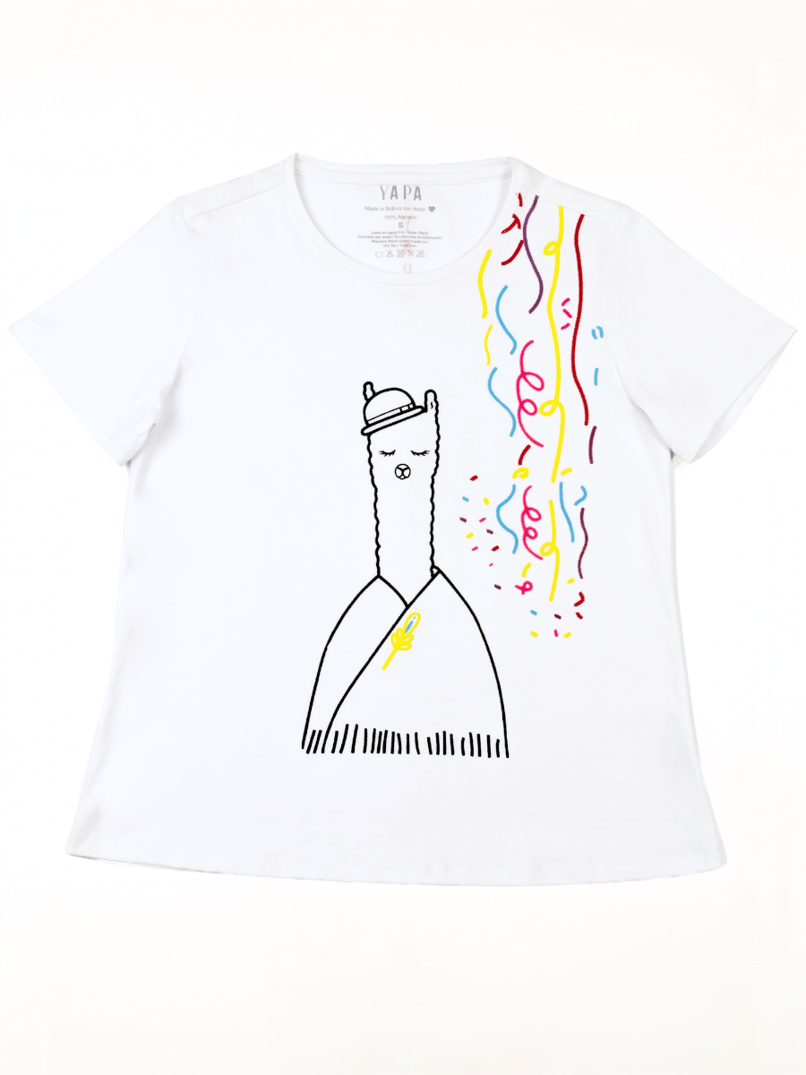 White cotton t-shirt featuring an embroidered alpaca in traditional attire with colorful confetti details on the side