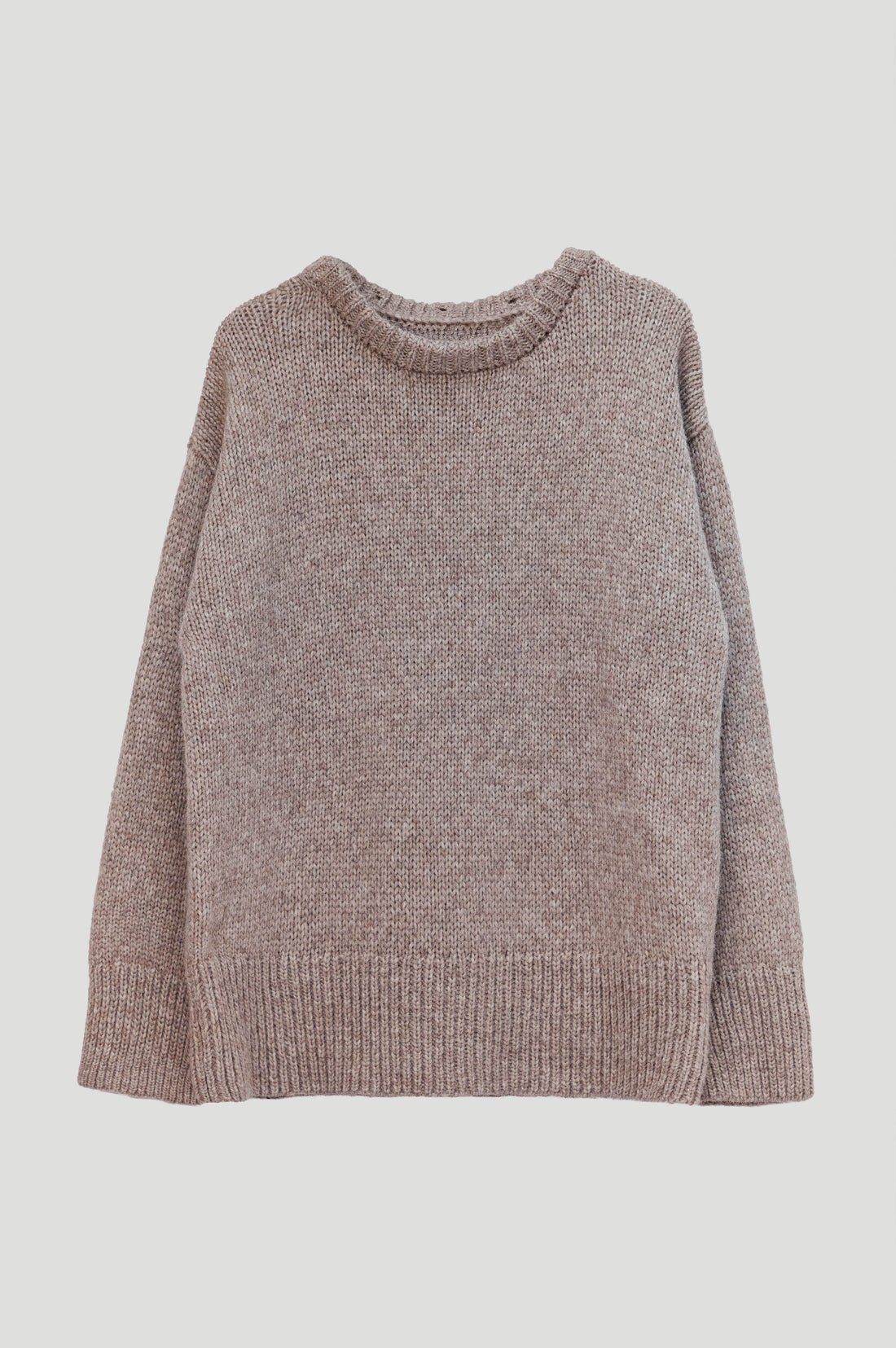 A chunky knit turtleneck sweater in a heathered taupe-brown color, shown against a solid light gray background.