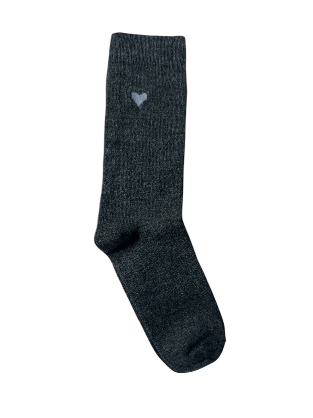 A pair of beige alpaca socks with a heart design on the ankle area.