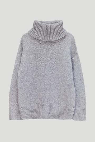A light gray knit turtleneck sweater with a ribbed collar, cuffs, and hem, displayed on a neutral light gray background.