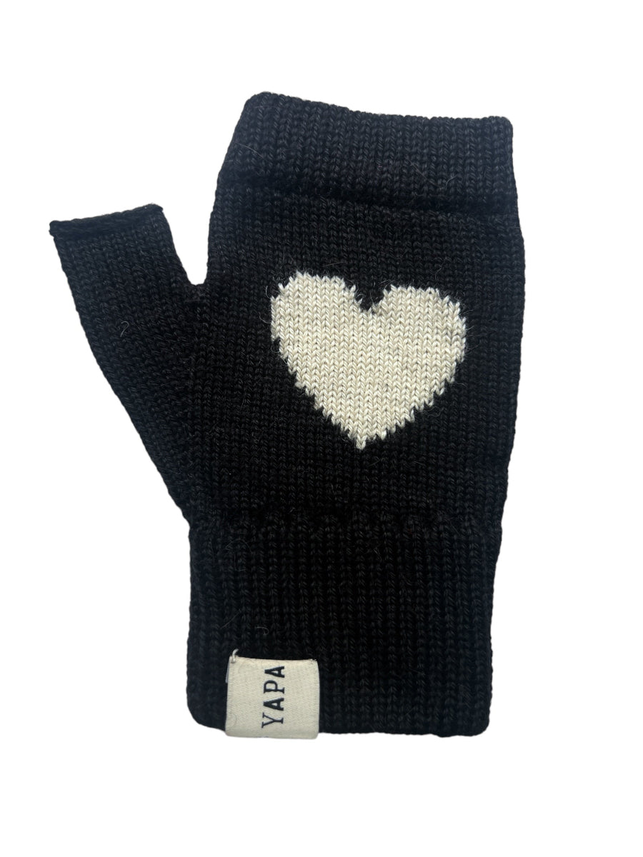 A pair of black baby alpaca wool mittens with a white heart design on the back, displayed against a white background.