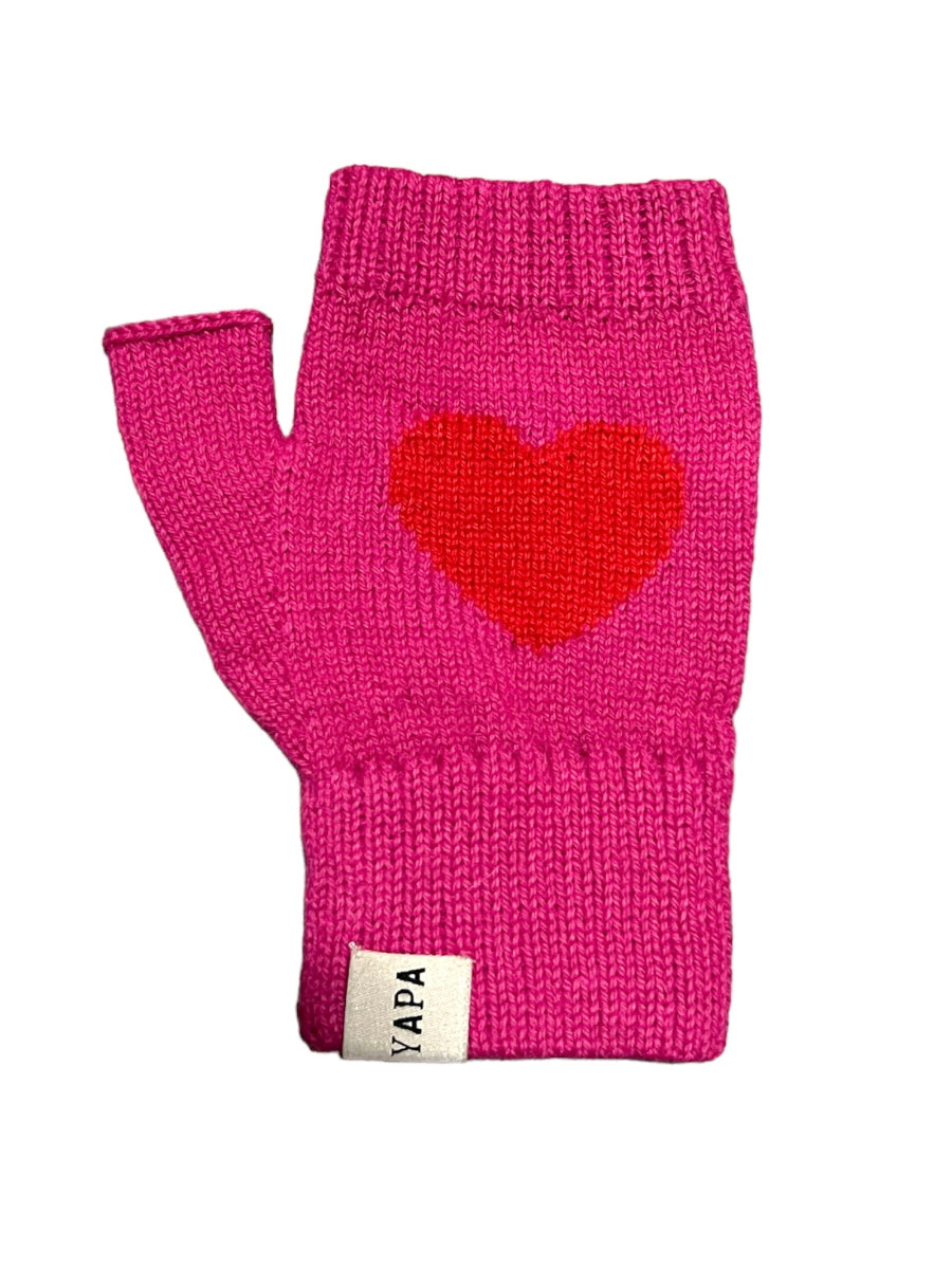 A pair of hot pink alpaca wool mittens with a heart design on the back of the hands, displayed against a white background.
