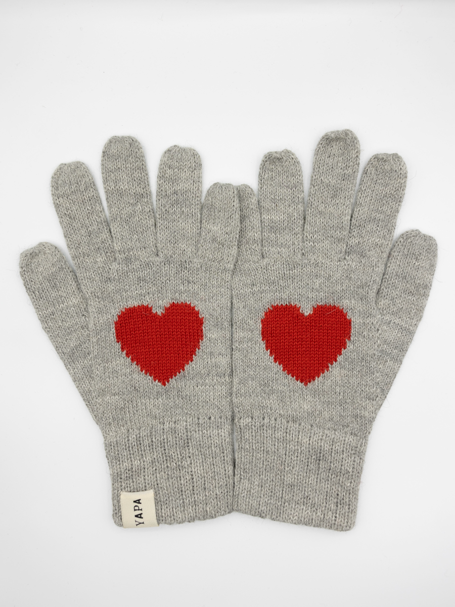 light grey alpaca knitted gloves with a red heart design in each hand
