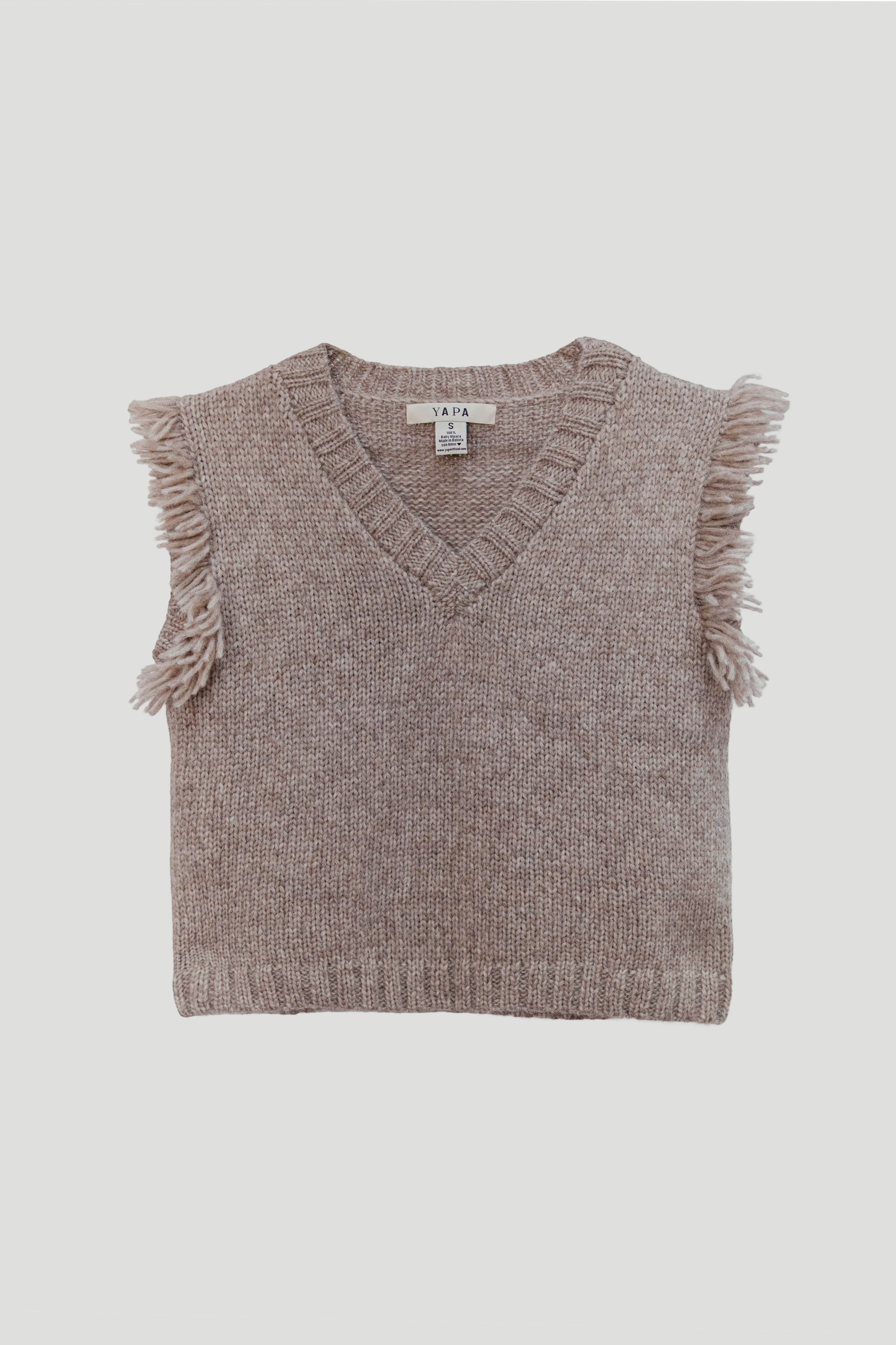 A sleeveless knit sweater vest in a heathered taupe-brown color, featuring a V-neckline and fringed trim on the sides, laid flat against a light gray background.