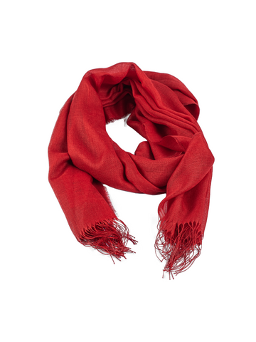 red alpaca scarf featuring a soft woven texture and fringed edges, shown against a plain background.