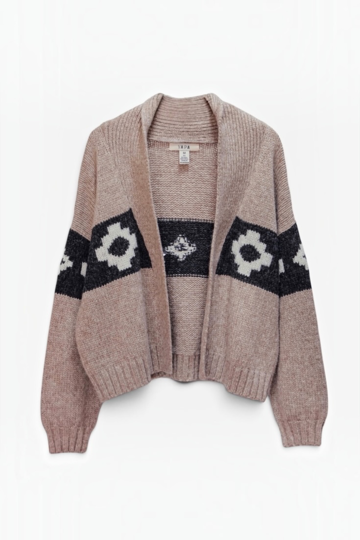 A knit open-front cardigan sweater in a dusty rose pink color, featuring black and white geometric patterns across the chest and sleeves, displayed on a clean white background.