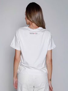 Person wearing a white t-shirt with YAPA and NY text on the back against a plain background