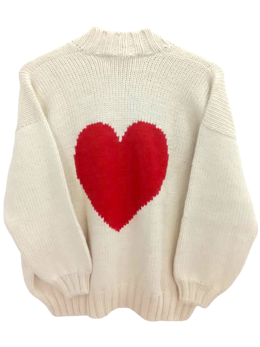 white alpaca cardigan featuring an oversized red heart motif on the back, shown against a plain background.