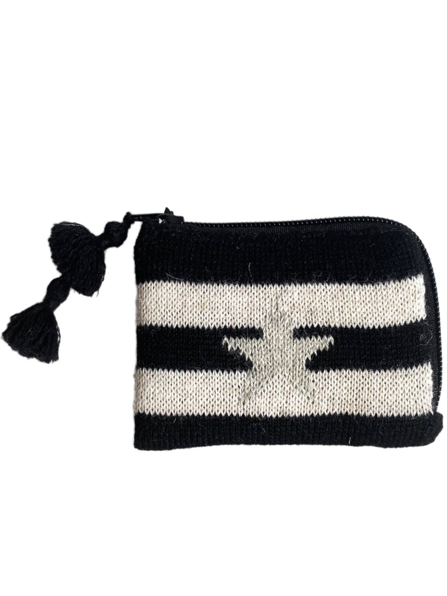 Black-and-white striped alpaca coin purse featuring a red heart motif on the front, finished with a zipper closure and tassel detail, shown against a plain background.