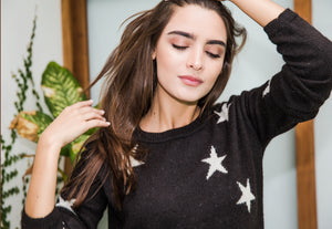 Stellar black stars alpaca wool sweater designed in Nyc sustainably made in Bolivia 