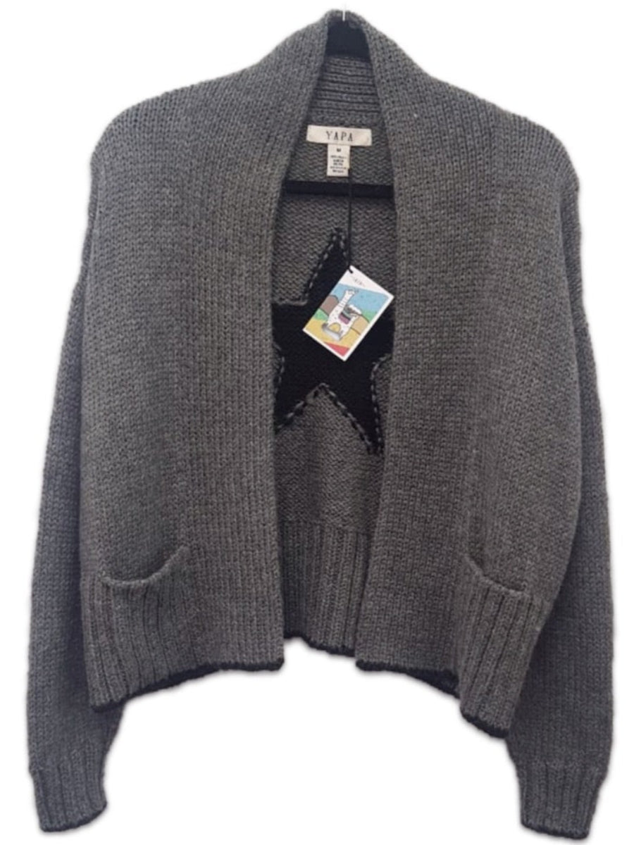 Grey alpaca chunky sweater featuring a large black star motif on the back