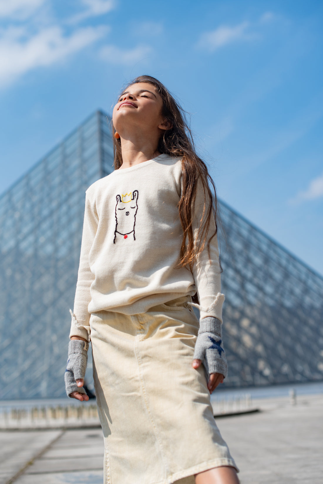 girl wearing an alpaca sweater outdoors